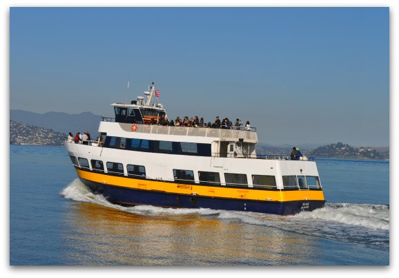 The blue and gold ferry cruising around the San Francisco bay.
