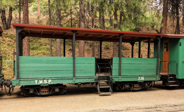 Covered seating train car