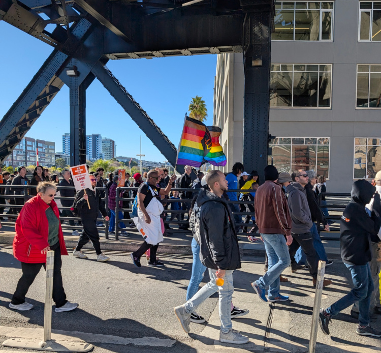 Crowds walking across the Lefty O'Doul Bridge in San Francisco on MLK Jr. Day
