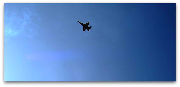 Single Blue Angels jet flying over Pier 39 during Fleet Week