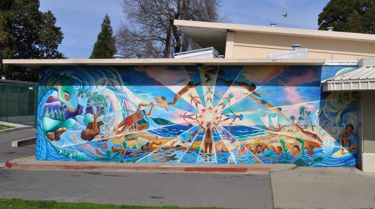 A mural on the side of the swimming pool building in Garfield Park in SF's Mission District.