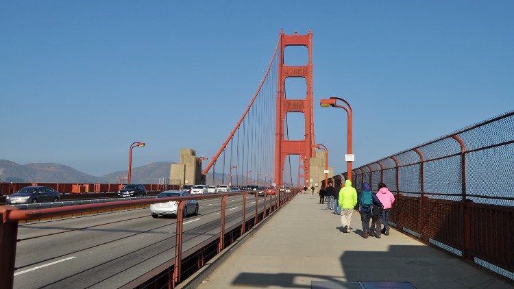 People walking across the Golden Gate Bridge