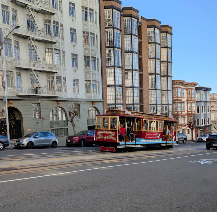 Powell Mason Cable Car coming up a hill