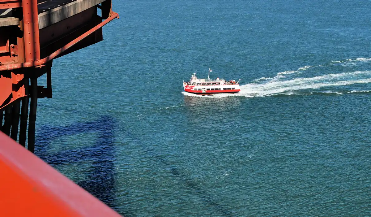 Red and White Bay Cruise heading under the Golden Gate Bridge Red and White Bay Cruise heading under the Golden Gate Bridge