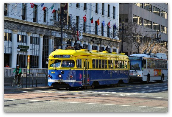 A yellow and blue street car in San Francisco