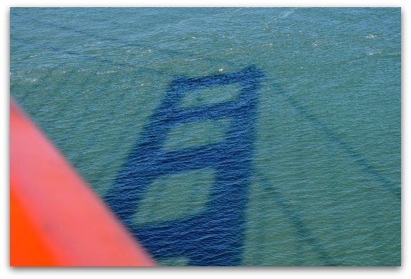 A shadow of the Golden Gate Bridge in the water